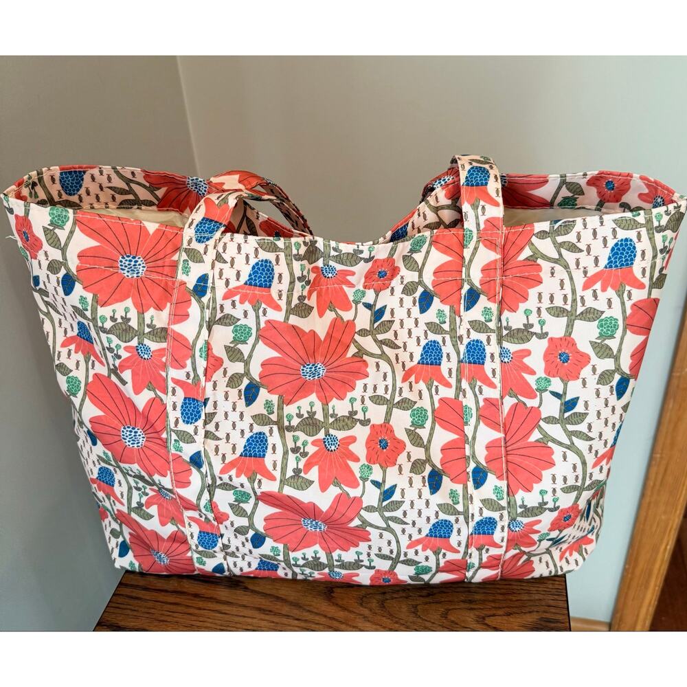 Oversized shoulder tote bag features a French-style romantic floral print. NWOT